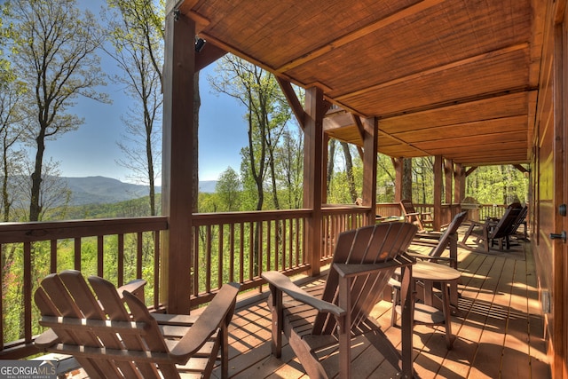 wooden terrace with a mountain view