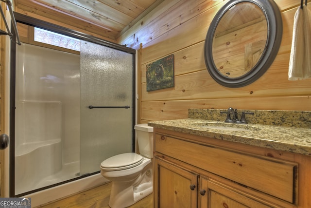 bathroom featuring wood ceiling, toilet, wood walls, vanity, and hardwood / wood-style flooring