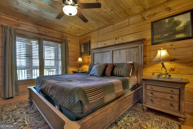 bedroom with wooden ceiling, ceiling fan, and dark wood-type flooring