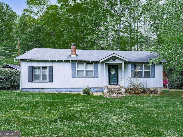 ranch-style house with a front lawn