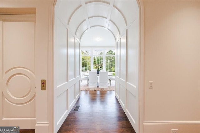 corridor featuring dark hardwood / wood-style flooring