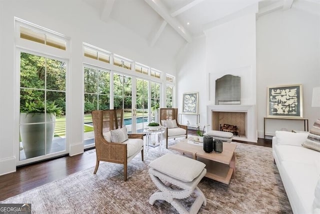 sunroom / solarium with lofted ceiling with beams