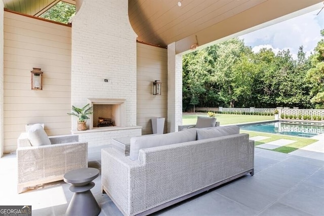 view of patio with a fenced in pool and outdoor lounge area