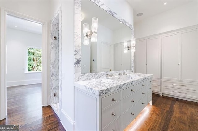 bathroom with vanity and hardwood / wood-style flooring