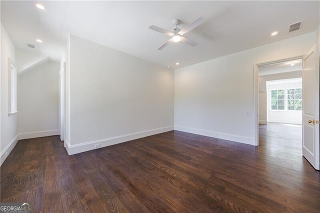 spare room with ceiling fan and dark hardwood / wood-style floors