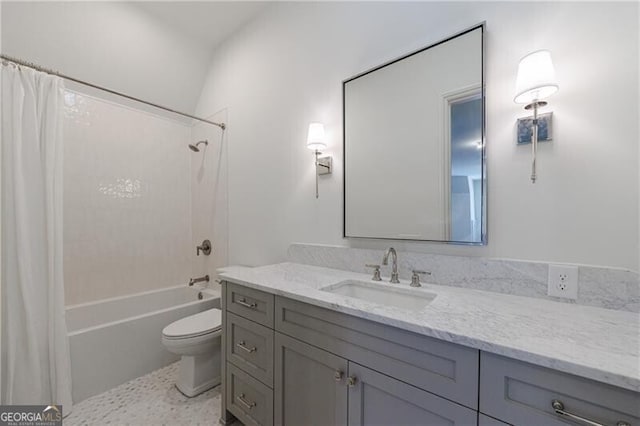 full bathroom with shower / bath combo, toilet, and vanity