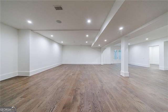 basement featuring hardwood / wood-style flooring