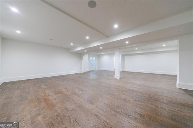 basement featuring hardwood / wood-style floors