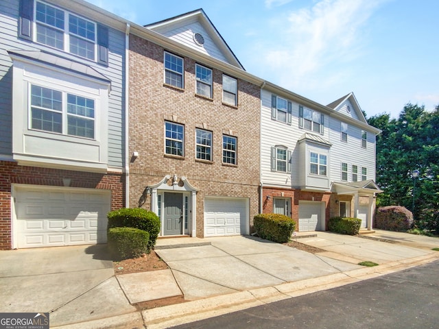 multi unit property featuring a garage