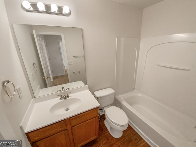 full bathroom featuring shower / washtub combination, wood-type flooring, toilet, and large vanity