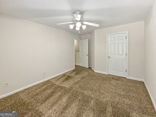 unfurnished bedroom with ceiling fan and carpet flooring