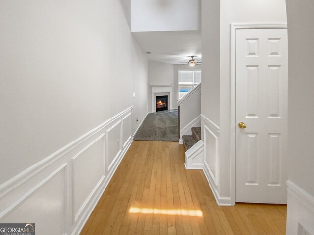 hallway with light hardwood / wood-style flooring