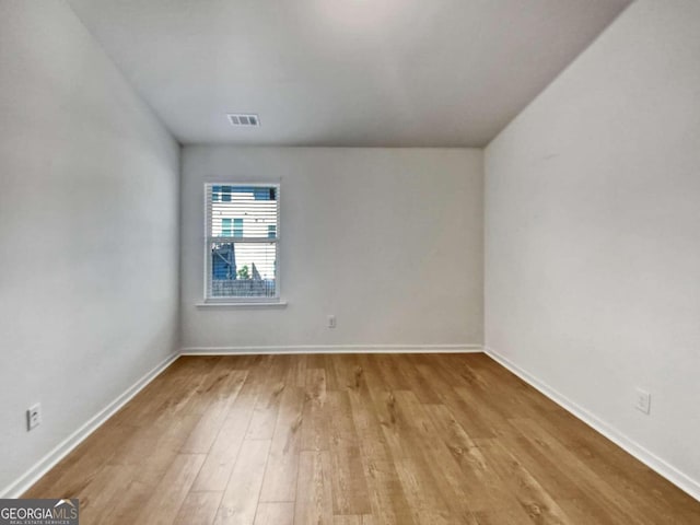 unfurnished room featuring light hardwood / wood-style floors