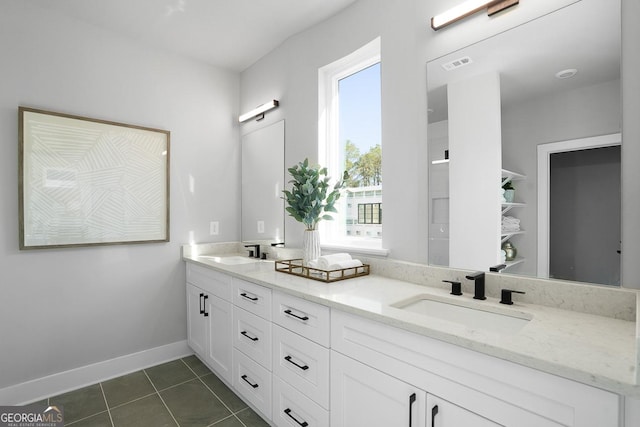 bathroom featuring tile patterned floors and vanity