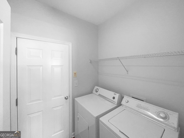 laundry room with washer and dryer