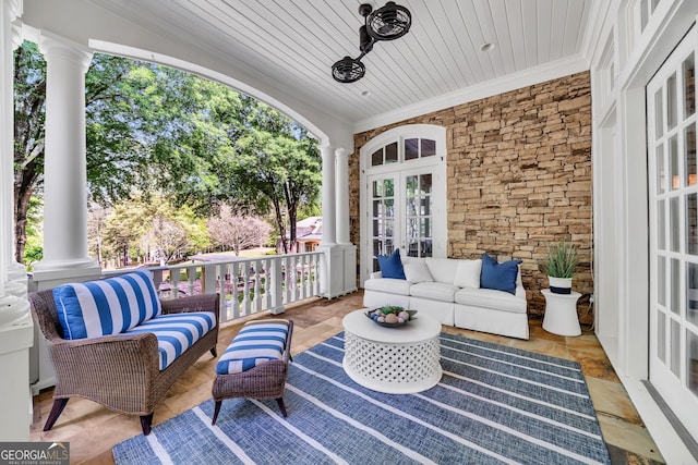 view of terrace with french doors and an outdoor hangout area