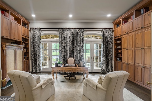 sitting room featuring french doors, a wealth of natural light, and hardwood / wood-style floors