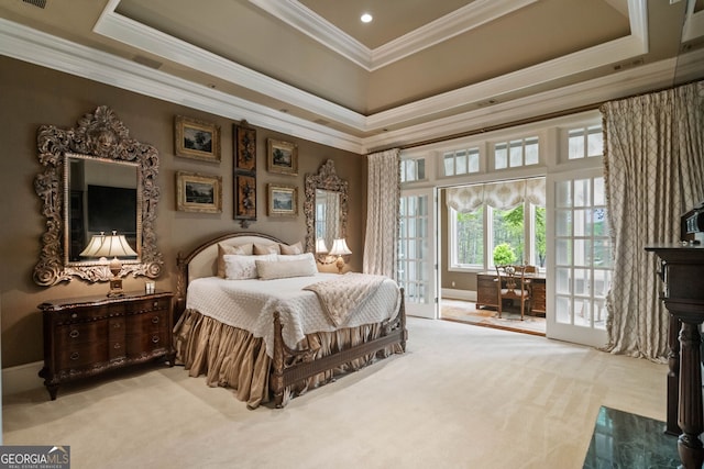 carpeted bedroom featuring a raised ceiling, access to exterior, and ornamental molding