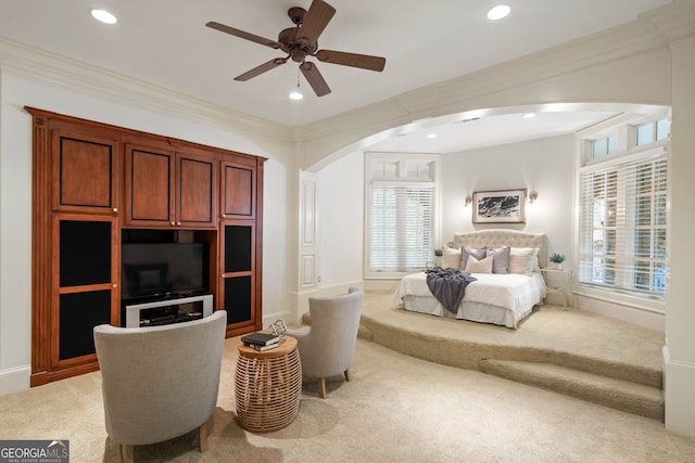 sitting room featuring ceiling fan, carpet, and ornamental molding