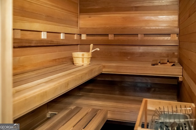 view of sauna with wood walls