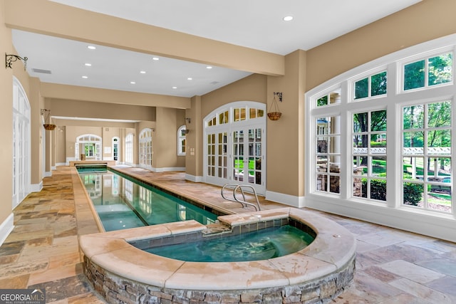 view of pool with french doors and an indoor in ground hot tub