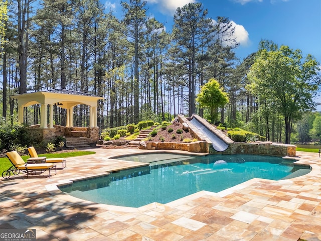 view of swimming pool with a patio area and a gazebo