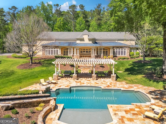 rear view of house featuring a pergola, a lawn, and a patio area