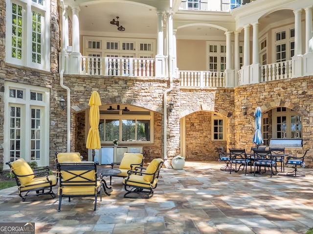 interior space with a patio, french doors, and a balcony