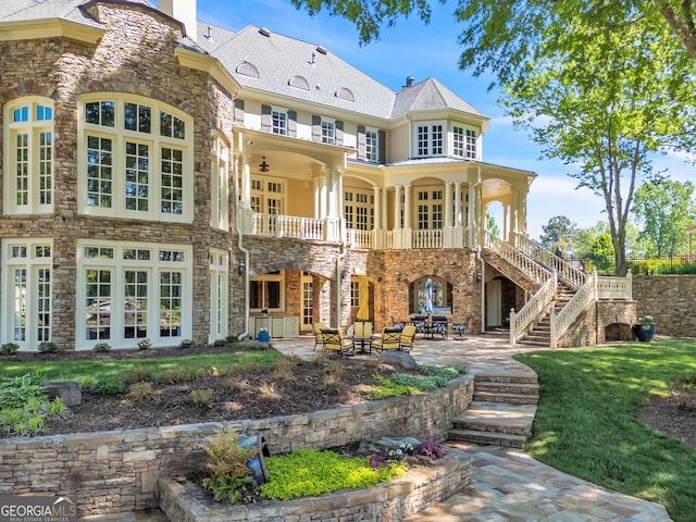 rear view of house with a patio and french doors