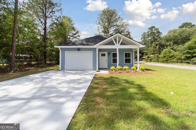 view of front of property with a front yard, a porch, and a garage