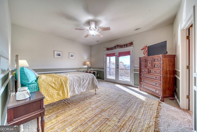 carpeted bedroom featuring french doors, ceiling fan, and access to outside