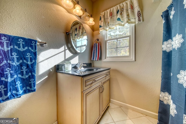 bathroom featuring large vanity and tile floors