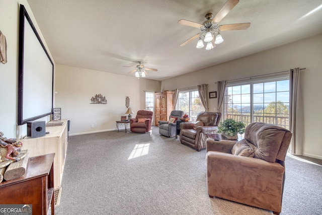 living room featuring ceiling fan and carpet flooring