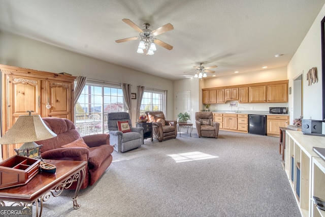 living room with carpet flooring and ceiling fan