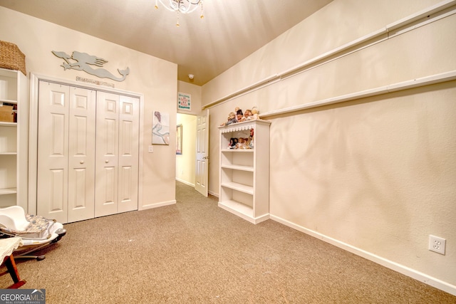 unfurnished bedroom with a closet and carpet floors