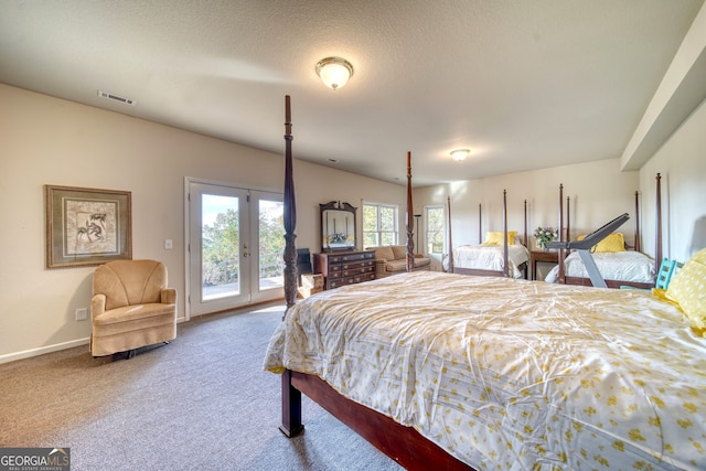 carpeted bedroom featuring french doors and access to exterior