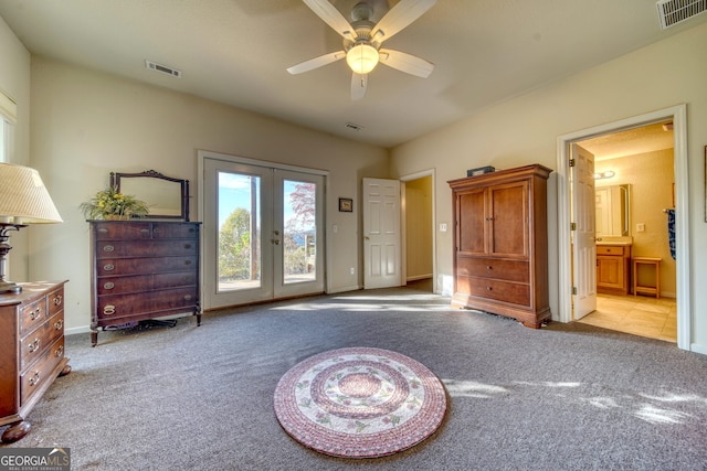 sitting room featuring light colored carpet, ceiling fan, and french doors