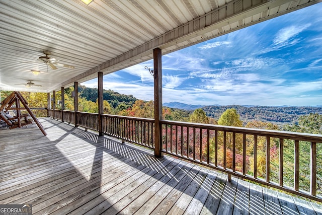 wooden terrace featuring ceiling fan