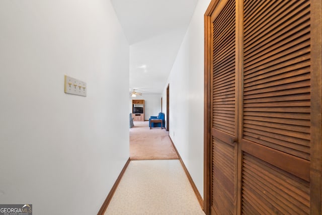 hallway featuring carpet flooring