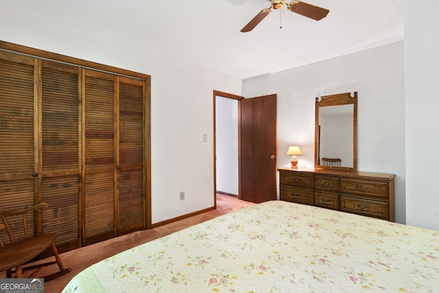 bedroom featuring ceiling fan, a closet, and carpet floors