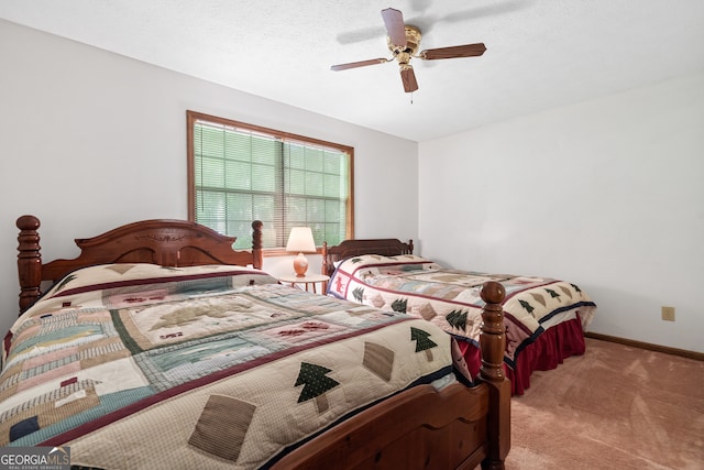 bedroom featuring ceiling fan and carpet floors