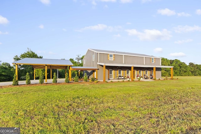 rear view of property with a yard