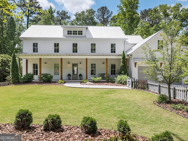 modern farmhouse with a porch and a front yard