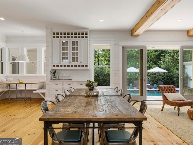 entrance foyer with crown molding, light hardwood / wood-style floors, and a notable chandelier