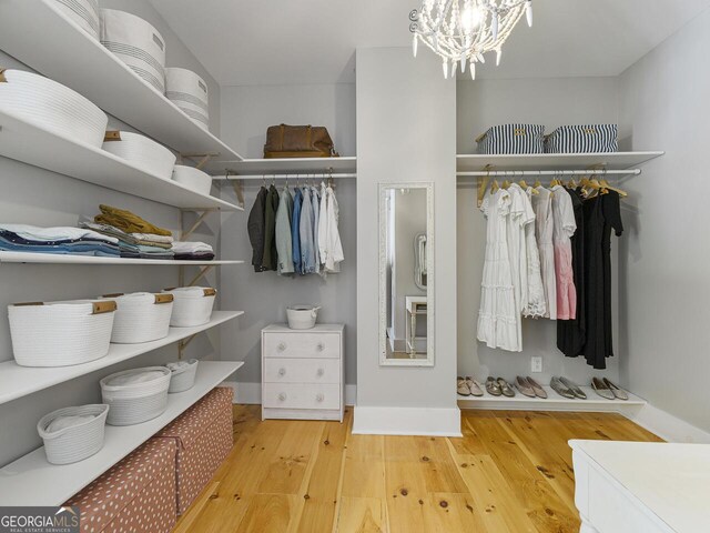 bathroom featuring vanity, walk in shower, and wooden walls