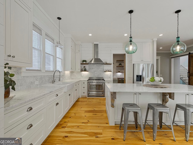 kitchen with a wealth of natural light, beamed ceiling, white cabinets, and hanging light fixtures