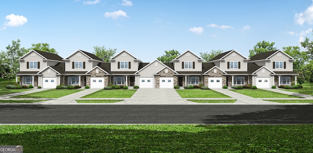 view of front of property featuring a garage and a front yard