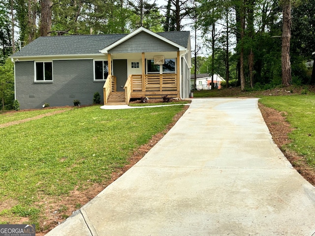 view of front of home with a front yard and a porch