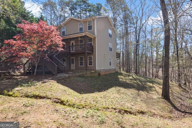 rear view of house with a lawn