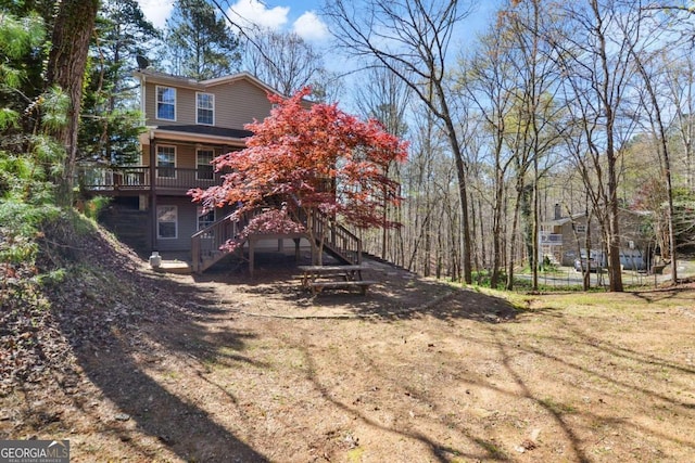 view of yard with a wooden deck